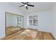 Bright bedroom features wood floors, closet with sliding doors, and double-paned windows at 2405 Pickwick Dr # 55, Henderson, NV 89014