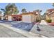 Townhome featuring garage and covered parking area at 2405 Pickwick Dr # 55, Henderson, NV 89014