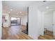 Open living room with modern floors, recessed lighting, and sliding glass door to a private patio with a bathroom nearby at 2405 Pickwick Dr # 55, Henderson, NV 89014
