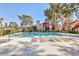 Relaxing community pool featuring multiple lounge chairs for sunbathing at 2405 Pickwick Dr # 55, Henderson, NV 89014