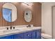 Modern bathroom featuring double sinks, stylish lighting, and contemporary finishes at 250 Shadybrook Ln # D, Las Vegas, NV 89107