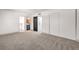 Spacious bedroom with neutral carpet, features two closets, and an en-suite bathroom at 250 Shadybrook Ln # D, Las Vegas, NV 89107