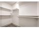 Walk-in closet features custom shelving, providing ample storage space at 250 Shadybrook Ln # D, Las Vegas, NV 89107