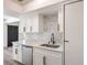 Well-lit kitchen with white cabinets, stainless steel appliances, and a sink at 250 Shadybrook Ln # D, Las Vegas, NV 89107