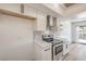 New kitchen with stainless appliances, white cabinets and stone countertops at 250 Shadybrook Ln # D, Las Vegas, NV 89107