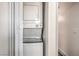 Convenient laundry area equipped with a stacked washer and dryer unit for efficient use of space at 250 Shadybrook Ln # D, Las Vegas, NV 89107