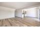 Open-concept living room showing wood floors and a view to the kitchen at 250 Shadybrook Ln # D, Las Vegas, NV 89107