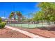 Community tennis court surrounded by lush greenery, perfect for recreational play and outdoor activities at 250 Shadybrook Ln # D, Las Vegas, NV 89107