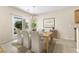 Dining room with backyard access and ample natural light, decorated with modern furnishings and décor at 2538 Capella Star St, Henderson, NV 89044