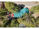 Aerial view of mountain home with green roof, deck, and surrounding mature trees at 274 Ski Trail Rd, Mount Charleston, NV 89124