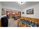 Basement game room with a pool table, foosball, and wood trim accents at 274 Ski Trail Rd, Mount Charleston, NV 89124