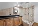 Modern bathroom with glass-enclosed shower and rustic wood vanity at 274 Ski Trail Rd, Mount Charleston, NV 89124