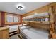 Bedroom featuring log-frame bunk beds and a twin bed, with wood paneled walls at 274 Ski Trail Rd, Mount Charleston, NV 89124