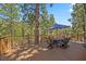 Relaxing outdoor deck area with seating and views of the surrounding forest at 274 Ski Trail Rd, Mount Charleston, NV 89124