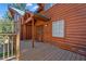 Inviting entryway featuring a wooden deck and charming details at 274 Ski Trail Rd, Mount Charleston, NV 89124