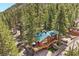 Beautiful mountain home with a green roof and extensive decking surrounded by mature trees at 274 Ski Trail Rd, Mount Charleston, NV 89124