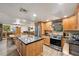 Modern kitchen boasts granite countertops, stainless steel appliances, and a functional center island at 274 Ski Trail Rd, Mount Charleston, NV 89124