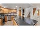Spacious kitchen boasts sleek countertops, modern appliances, and convenient access to the staircase at 274 Ski Trail Rd, Mount Charleston, NV 89124