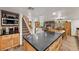 Open-concept kitchen featuring granite counters, wooden cabinetry, and seamless flow to living spaces at 274 Ski Trail Rd, Mount Charleston, NV 89124