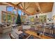 Open-concept living area with vaulted ceilings, large windows, and ample seating at 274 Ski Trail Rd, Mount Charleston, NV 89124