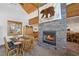 Cozy living room with a beautiful stone fireplace and rustic decor, creating a warm ambiance at 274 Ski Trail Rd, Mount Charleston, NV 89124