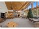 Spacious living room with vaulted ceilings, large windows, and comfortable seating at 274 Ski Trail Rd, Mount Charleston, NV 89124