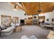 Bright, open living area with a stone fireplace and mountain-themed decor at 274 Ski Trail Rd, Mount Charleston, NV 89124