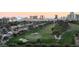Panoramic view from above of Las Vegas cityscape and lush golf course landscape at 3111 Bel Air Dr # 12E, Las Vegas, NV 89109