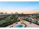 Aerial view of community pool and Las Vegas skyline, showcasing the property's prime location at 3111 Bel Air Dr # 12E, Las Vegas, NV 89109