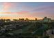 Scenic aerial view of the Las Vegas area with golf course and beautiful sunset colors at 3111 Bel Air Dr # 12E, Las Vegas, NV 89109