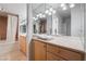 Bathroom features dual vanity sink and a walk in shower at 3111 Bel Air Dr # 12E, Las Vegas, NV 89109