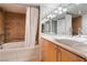 Modern bathroom boasts a shower with white curtain and a stylish vanity at 3111 Bel Air Dr # 12E, Las Vegas, NV 89109
