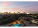 Enjoy sunset views of the Las Vegas city skyline from this residence's private balcony and community pool at 3111 Bel Air Dr # 12E, Las Vegas, NV 89109