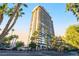 High-rise building with balconies and palm tree landscaping at 3111 Bel Air Dr # 12E, Las Vegas, NV 89109