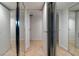 Hallway with doors and mirrored closet doors, showcasing the spacious layout at 3111 Bel Air Dr # 12E, Las Vegas, NV 89109