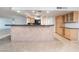 Open layout featuring a kitchen bar and cabinetry at 3111 Bel Air Dr # 12E, Las Vegas, NV 89109