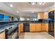 Bright kitchen features stainless steel appliances, granite countertops, and light wood cabinetry at 3111 Bel Air Dr # 12E, Las Vegas, NV 89109