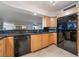 Well-lit kitchen with stainless appliances, granite countertops, and light wood cabinets at 3111 Bel Air Dr # 12E, Las Vegas, NV 89109