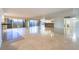 Open living room with marble floors and mirrored wall at 3111 Bel Air Dr # 12E, Las Vegas, NV 89109