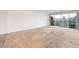 Expansive living room offering city views from sliding glass doors leading to balcony at 3111 Bel Air Dr # 12E, Las Vegas, NV 89109