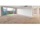 Spacious living room with sliding glass doors offering city views at 3111 Bel Air Dr # 12E, Las Vegas, NV 89109