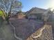 Spacious backyard features desert landscaping, offering low-maintenance charm and potential at 3388 Old Course St, Las Vegas, NV 89122