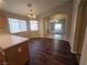 Dining area leading into a living room with lots of light and hardwood floors at 3388 Old Course St, Las Vegas, NV 89122