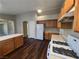 Spacious kitchen with oak cabinets, white appliances, and hardwood floors at 3388 Old Course St, Las Vegas, NV 89122