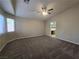 Expansive room featuring neutral paint, new carpet and a ceiling fan at 3388 Old Course St, Las Vegas, NV 89122