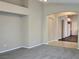 Inviting living room with neutral paint, new carpet and seamless flow into the kitchen at 3388 Old Course St, Las Vegas, NV 89122
