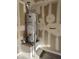 Garage water heater and updated wall, blending functionality with potential for renovation at 3388 Old Course St, Las Vegas, NV 89122