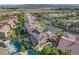 Scenic aerial view of a neighborhood featuring solar panels, desert landscaping and mountain views at 3618 Auckland Castle St, Las Vegas, NV 89135