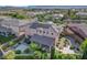 Aerial view of a desert home featuring solar panels, covered patio, and lush backyard at 3618 Auckland Castle St, Las Vegas, NV 89135