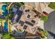 Bird's eye view of a beautiful home with solar panels, backyard pool, patio, and lush landscaping at 3618 Auckland Castle St, Las Vegas, NV 89135